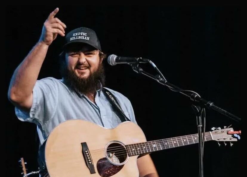Chance Stanley energizes the crowd with an exciting live guitar performance.