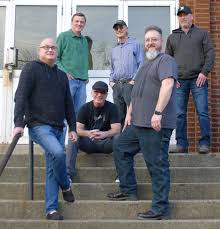 A group of friends enjoying time together outside on the steps.