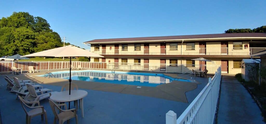 Relax by the pool at a charming motel with scenic views.