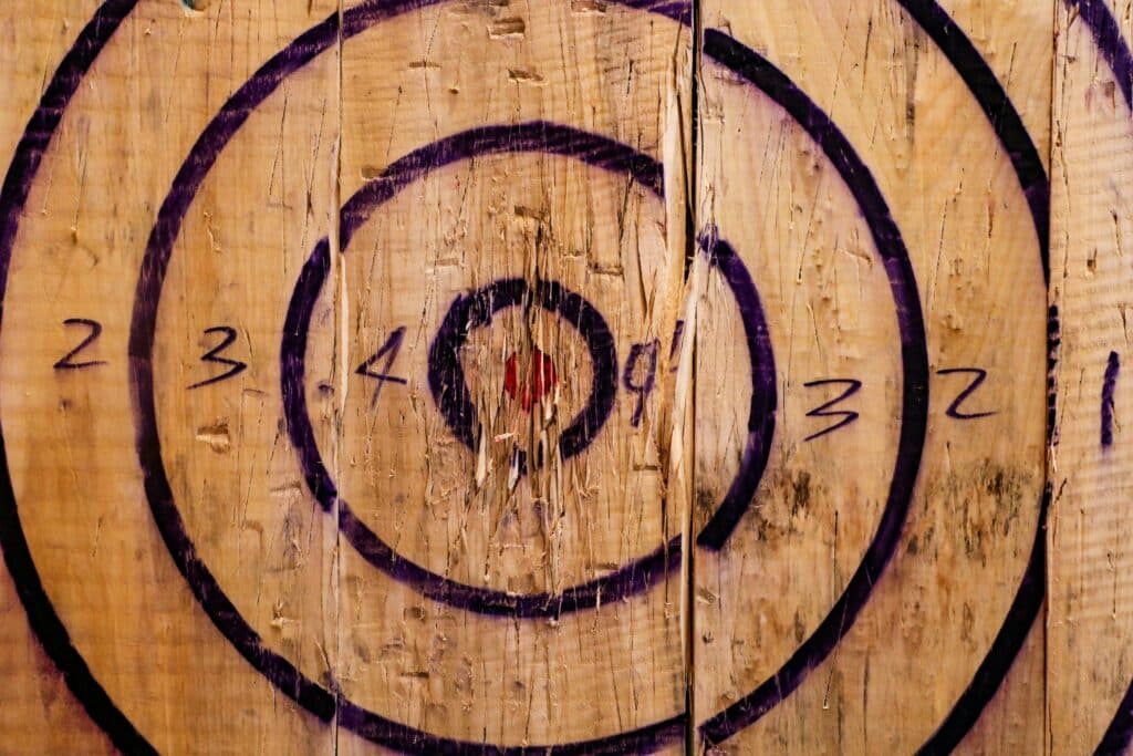 Colorful target wall art featuring concentric circles on wooden background for decor inspiration.