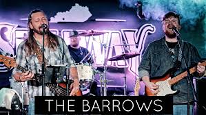 The Barrows perform live, showcasing their music talent on stage.