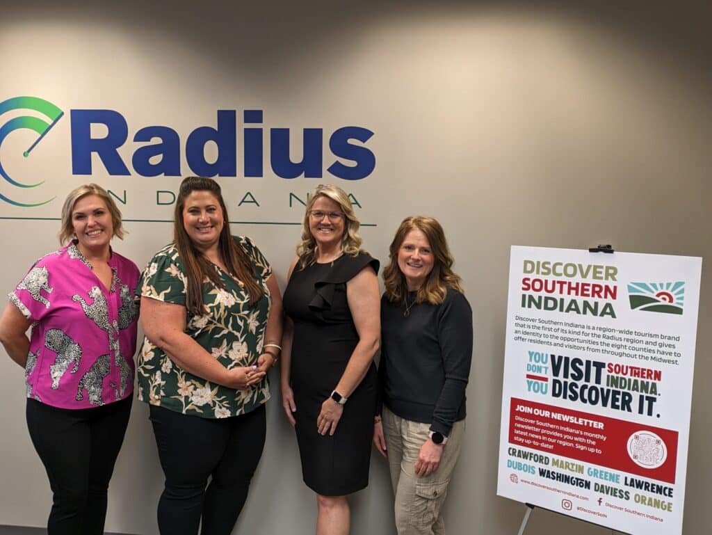 Women promoting Discover Southern Indiana tourism at Radius Indiana office.
