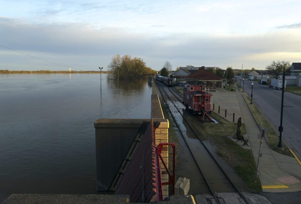 River flooding parks in 2023, showcasing submerged landscapes and affected rail infrastructure.