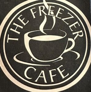 Freezer Cafe menu featuring a steaming cup of coffee in a stylish logo design.