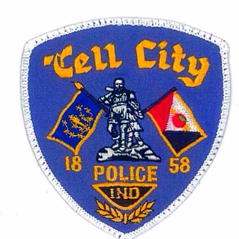 Cell City police badge featuring statue and state flags, representing Indiana law enforcement.